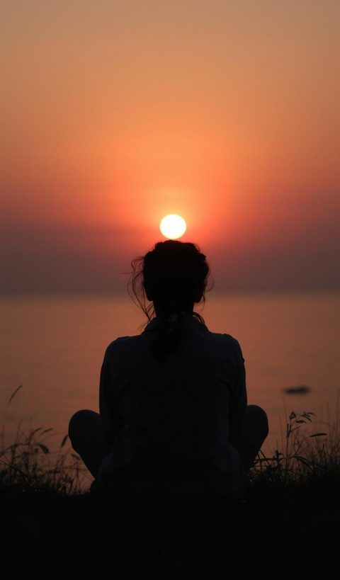 person_looking_at_a_sunrise